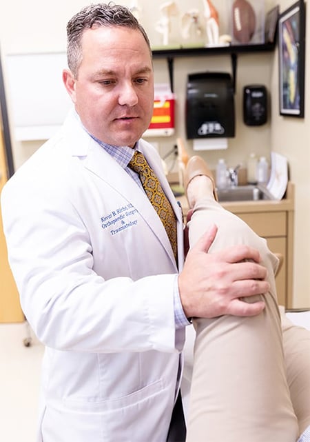 Dr. Riche examines a patient